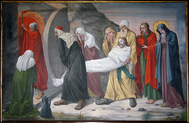 Statie 14: Jezus wordt in het graf gelegd. 